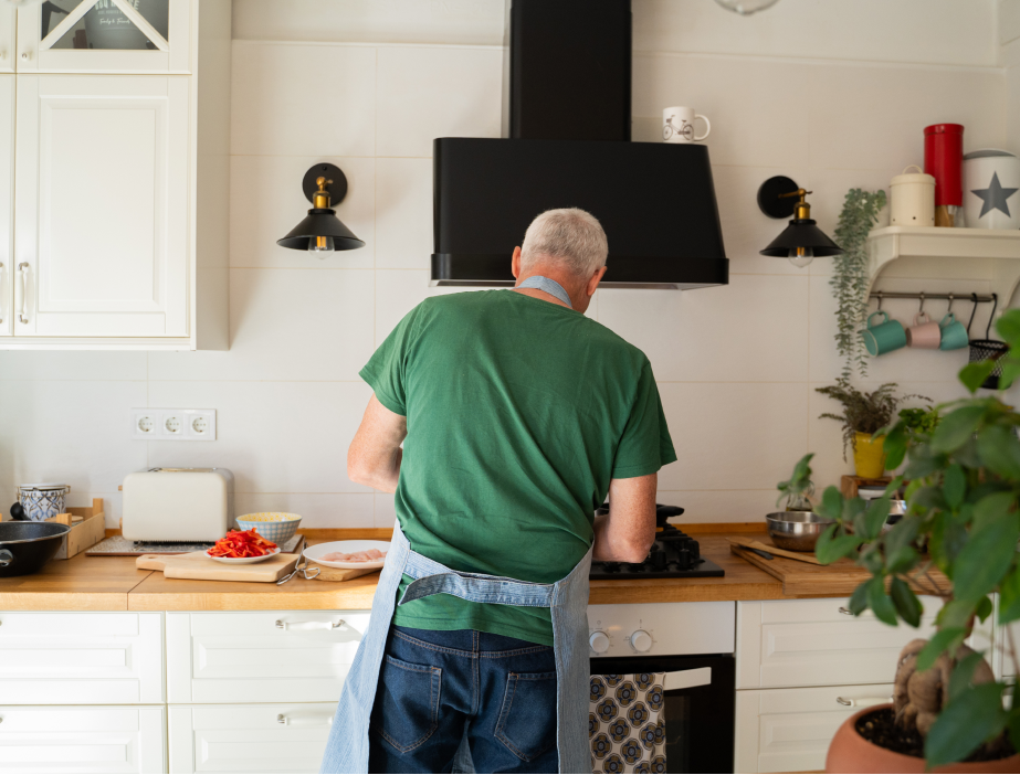Man preparing food in his kitchen.