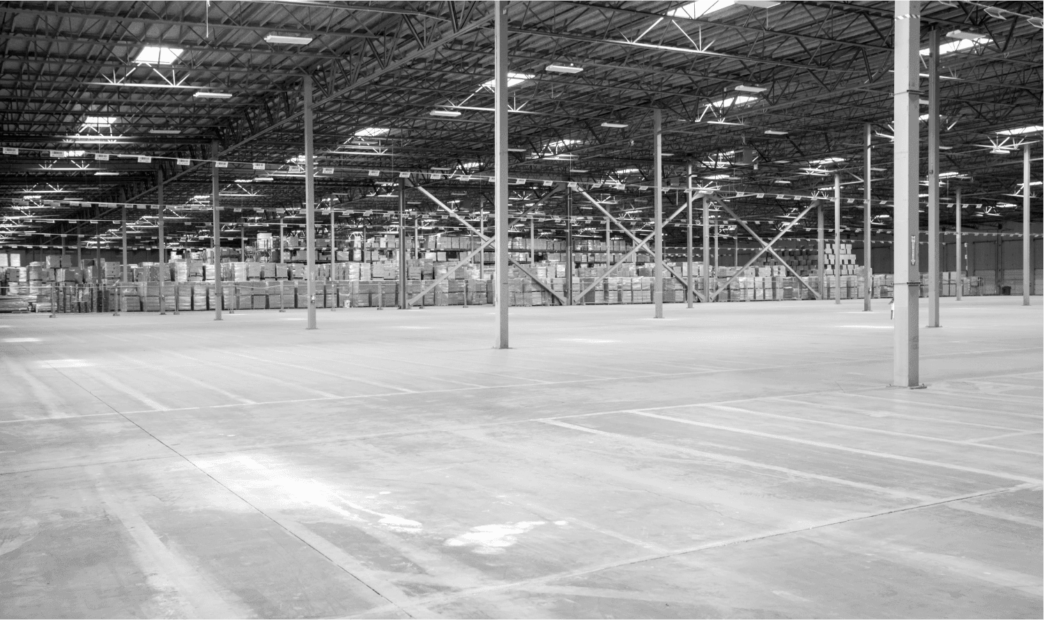 A large warehouse stands mostly empty.