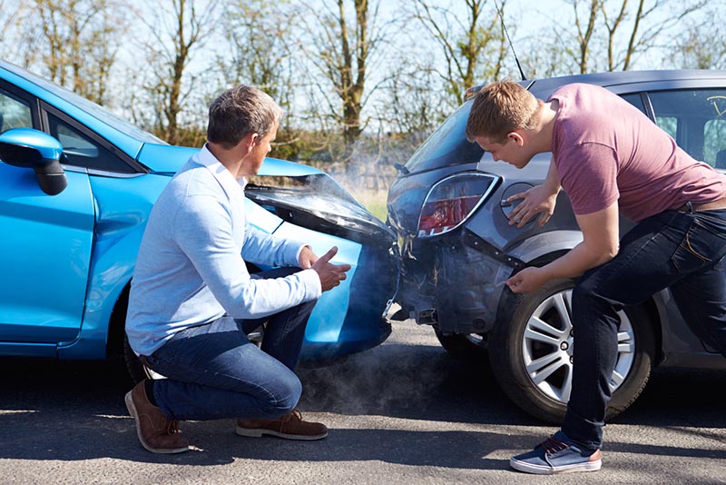 Car owners discuss a collision resulting in damage needing car insurance coverage